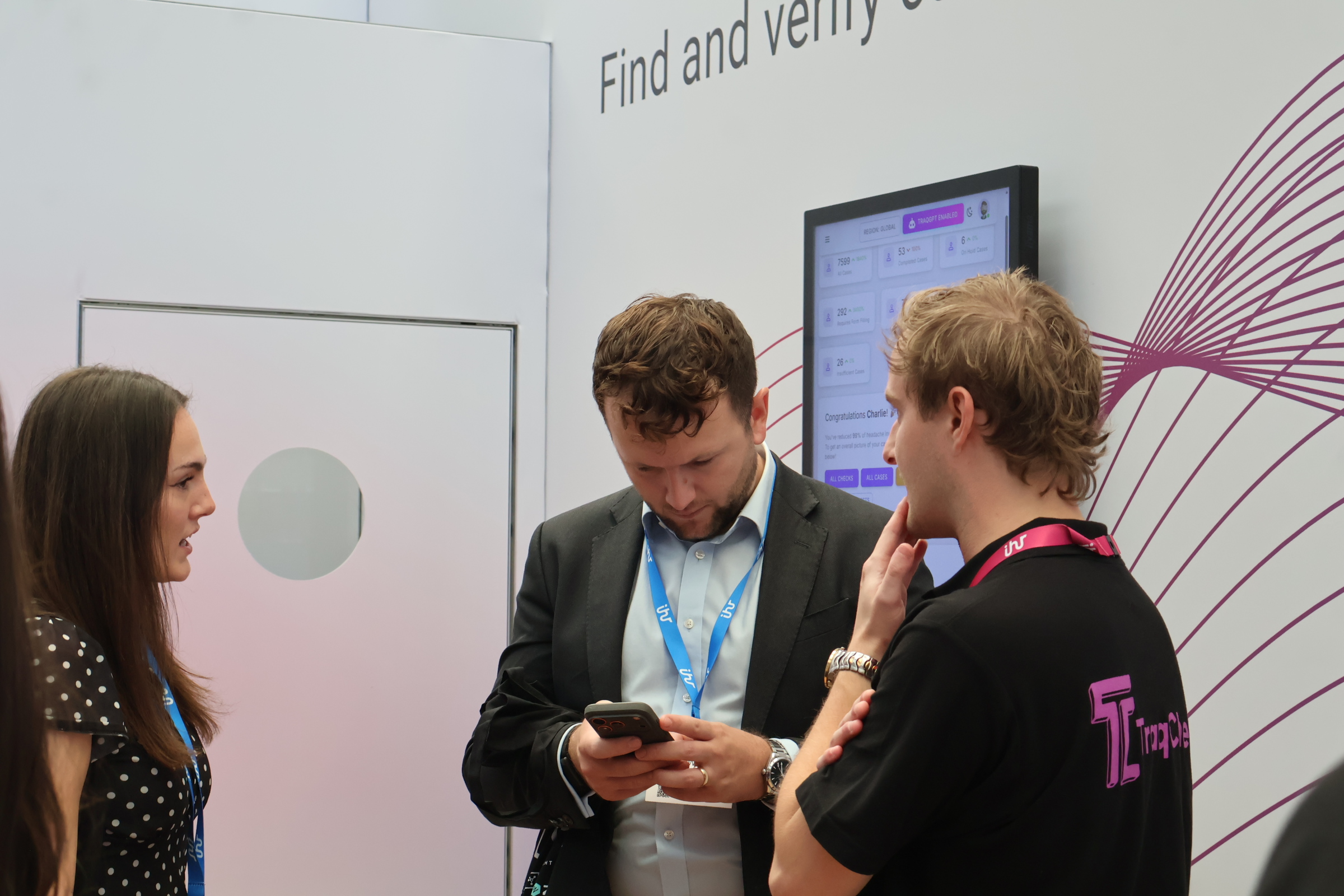 TraqCheck team members discussing a project