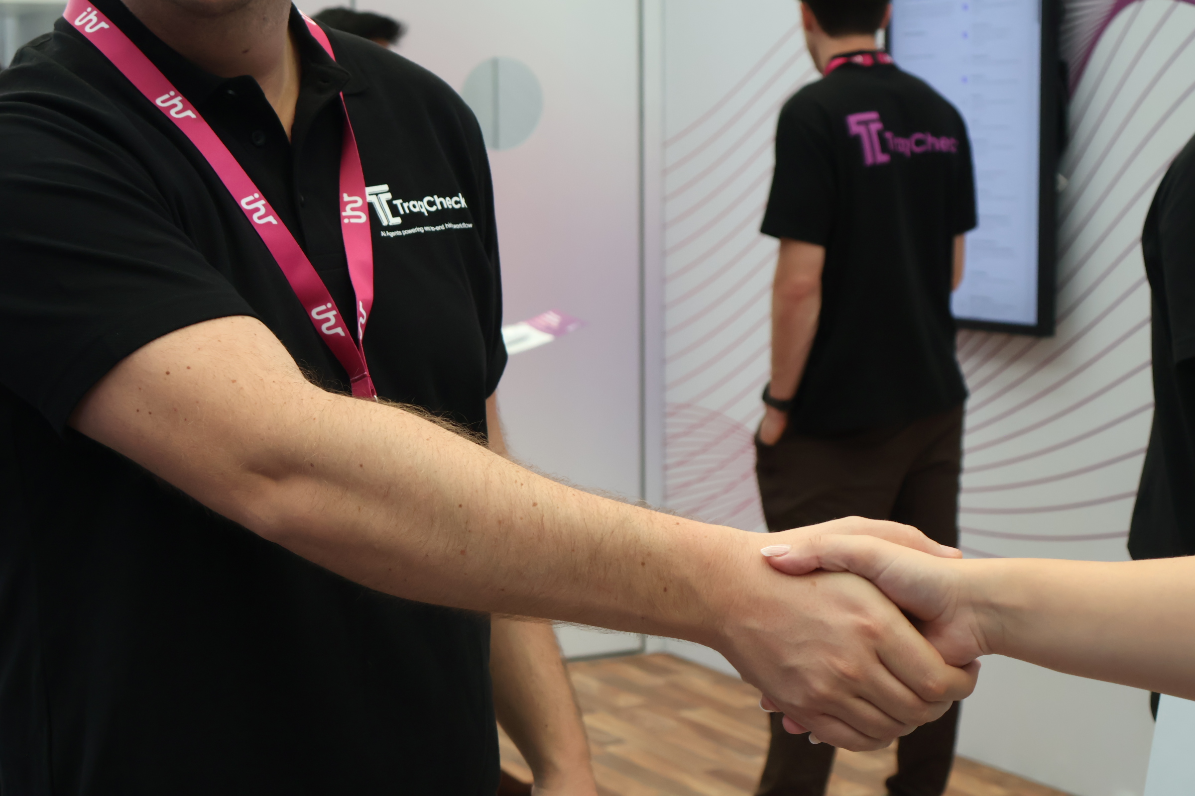 Professionals shaking hands after forming a partnership